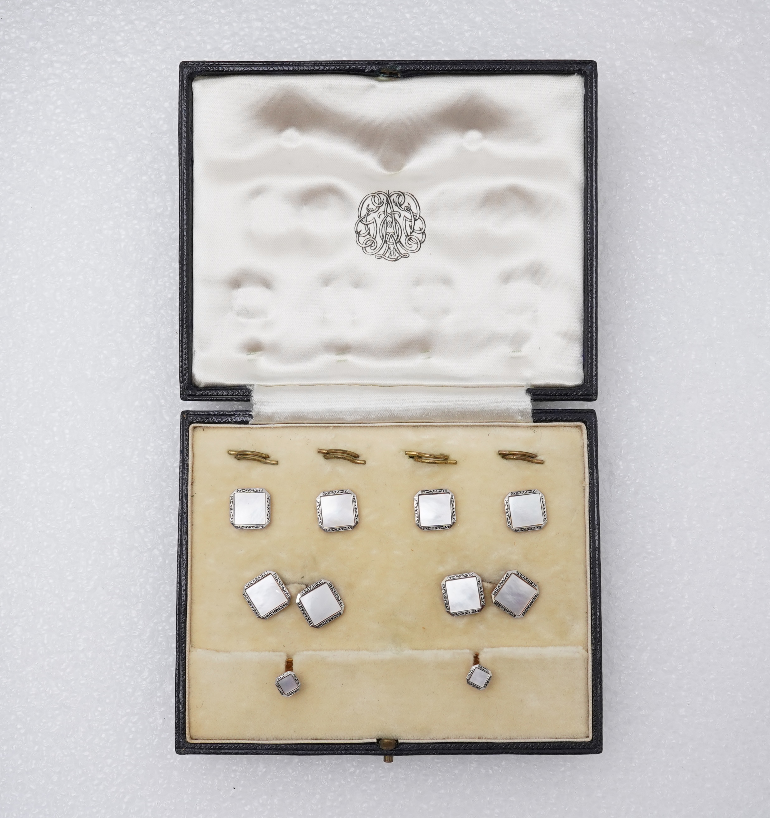 A mother of pearl dress set , early 20th century